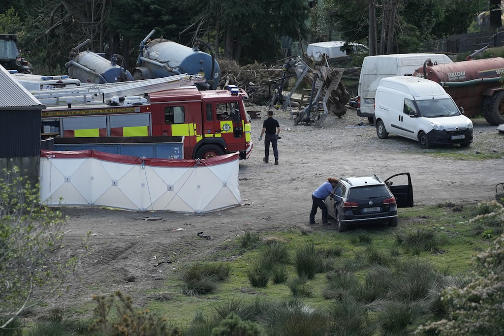 Emergency personnel on scene as excavations continued on the farm of Michael Gaine near Kenmare on Monday. Photograph: Noel Sweeney/PA Wire