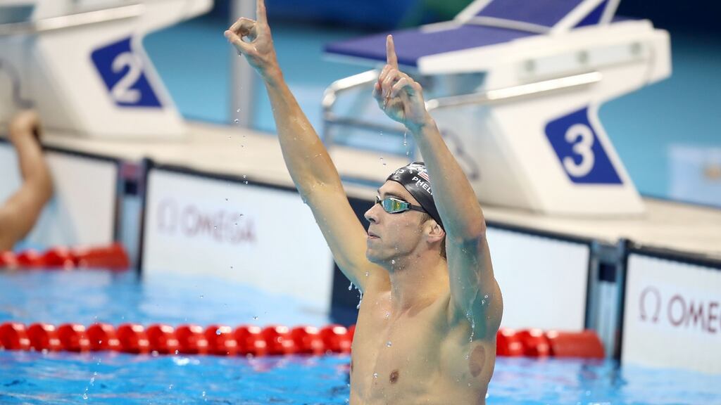 USA’s Michael Phelps celebrates winning the men’s 200m butterfly final at the Olympic Aquatics Stadium. Photograph: Mike Egerton/PA Wire