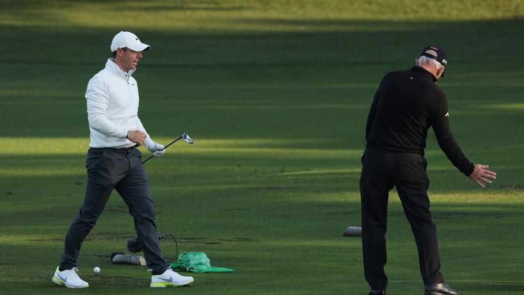 Rory McIlroy working with coach Pete Cowen on the range at the Masters back in April. Photograph: Kevin C Cox/Getty Images