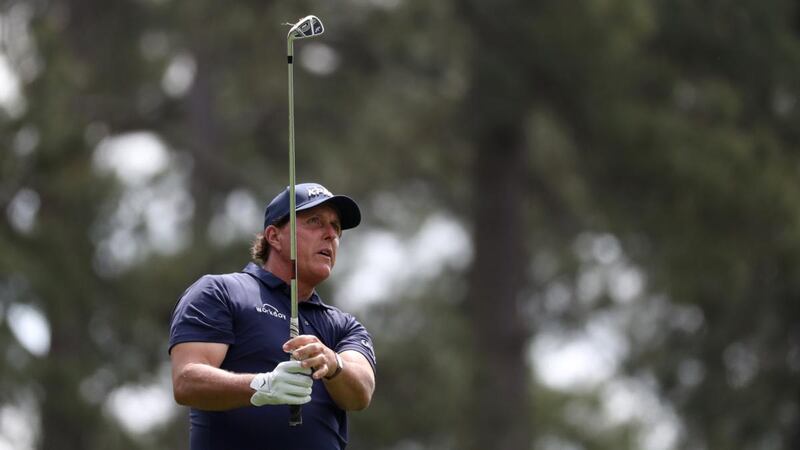 Phil Mickelson watches his tee shot on the fourth hole during the second round. Photograph:  Lucy Nicholson/Reuters