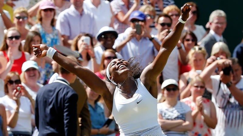 Serena Williams celebrates after beating Garbine Muguruza to claim a sixth Wimbledon singles title. Photograph: Suzanne Plunkett/Reuters