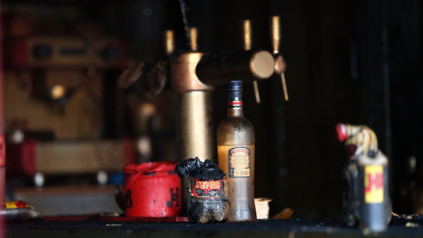 Bottles pictured in the bar where a fire broke out in Rouen. Photograph: Kamil Zihnioglu/AP