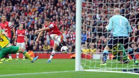 Özil grabs two as Arsenal hold on to top spot