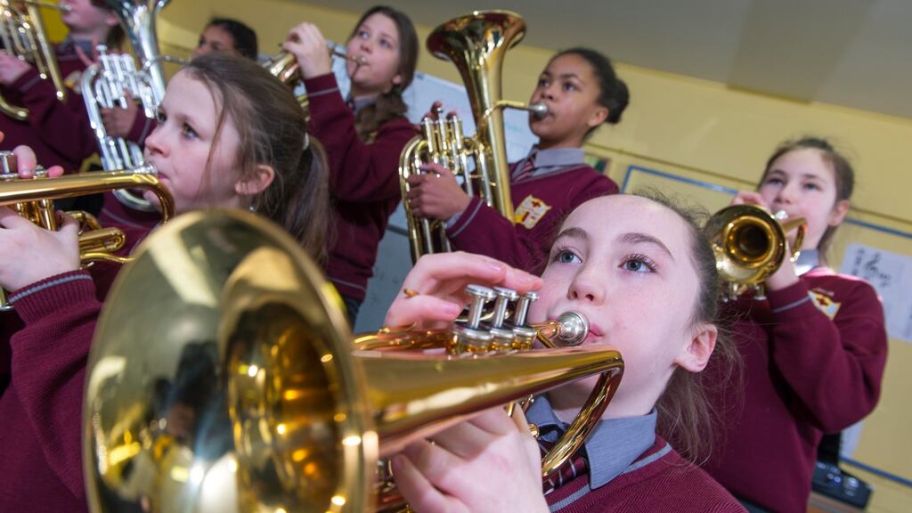 Schoolkids learning musical instruments with tutor Michael Mullins at Scoil na Croise Naofa, Avenue de Rennes, Mahon, Cork city. Photograph: Michael Mac Sweeney/Provision