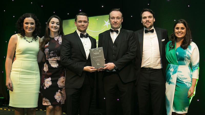 Ross Mc Donnell, Sponsorship Manager, Media Central presents the Best Sponsorship Brand award to the AIG Insurance Marketing team.