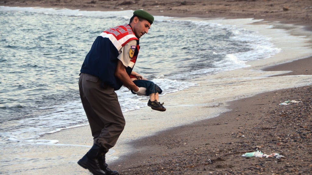 A paramilitary police officer carries the body of Alan Kurdi (3) after a number of migrants died when the boats carrying them to the Greek island of Kos capsized near the Turkish resort of Bodrum on September 2nd, 2005. Photograph: AP Photo