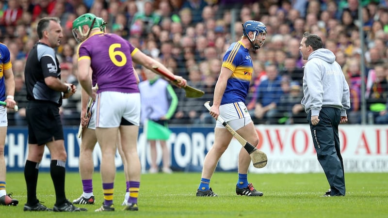 Davy Fitzgerald clashes with Jason Forde of Tipperary during the Allianz Hurling League Division 1A semi-final at Nowlan Park in Kilkenny. Photograph: ©INPHO/Ryan Byrne