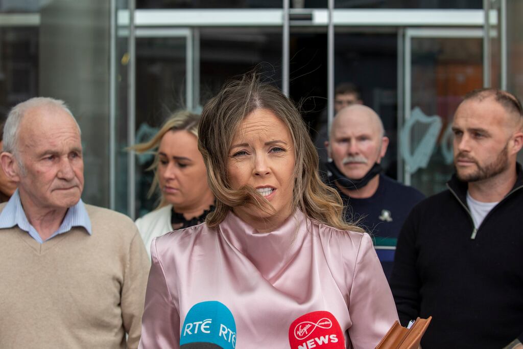 Garda Lisa Mullins, with members of Gerry Nolan’s family, speaks to media outside the Central Criminal Court after the sentence hearing for Martin Kelly who admitted killing Gerry Nolan, in 2006. Photograph: Collins Courts
