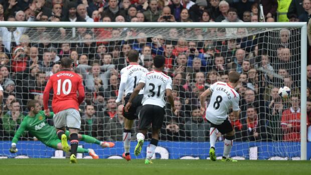 Liverpool’s Steven Gerrard (right) scores the opening goal at Old Trafford. Photograph: Photograph: Peter Powell/EPA