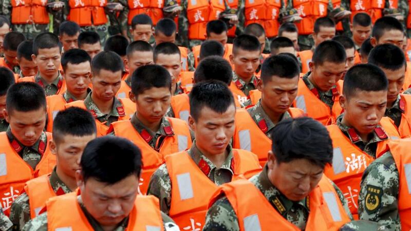 Soldiers observe a moment of silence at a ceremony to mark seven days since the ‘Eastern Star’ capsized on the Yangtze River, Hubei province, China, June 7th, 2015. Photograph: Reuters/Kim Kyung-Hoon