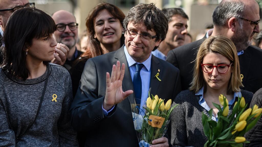 Former Catalan leader Carles Puigdemont poses with fellow politicians after a press conference in Berli. Photograph: EPA