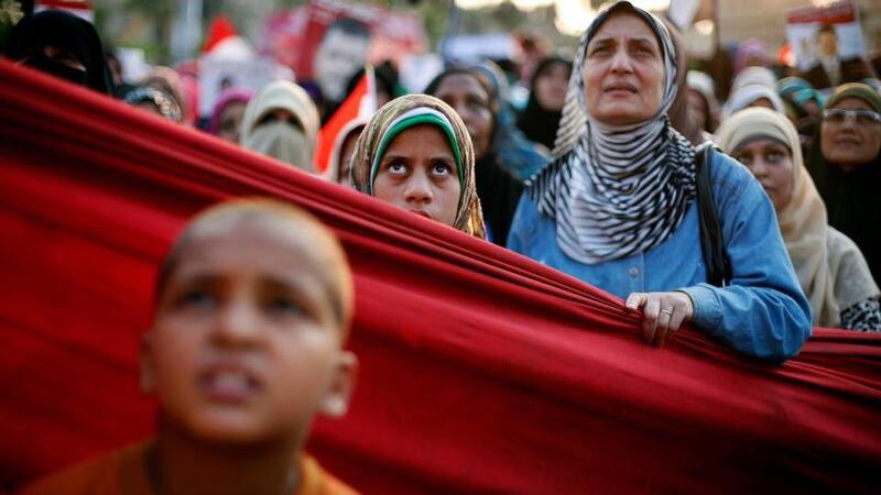 Mursi supporters   listen to a speech during a protest in Cairo yesterday. Photograph: Suhaib Salem/Reuters