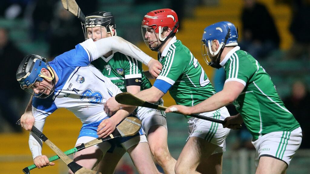Limerick’s Wayne McNamara, Michael Reidy and Richie McCarthy tackle Austin Gleeson of Waterford. Photograph: Cathal Noonan/Inpho