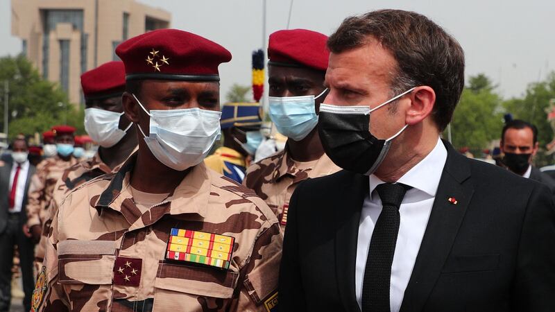 French president Emmanuel Macron, flanked by the son of the late Chadian president Idriss Déby’s son, Mahamat, I arrives to attend Déby’s state funeral on Friday. Photograph: Christophe Petit Tesson/AFP via Getty Images