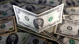 Dollar hits new  14-year high as euro edges towards parity