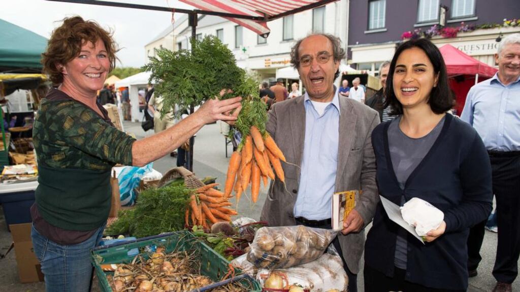 Palestinian Ambassador Ahmad Abdelrazek and his wife Rania Abdallah with Lisa Nolan from Kinvara during their visit to the farmers’ market in the Co Galway village, where a ban on Israeli goods is in place in opposition to the killing of children in Gaza. Photograph:Joe O’Shaughnessy