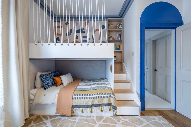 A very smart use of colour and customised joinery to create bespoke bunk beds with an arch of Tikkurila navy blue drawing attention to the period ceiling heights