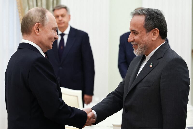 Russia's president Vladimir Putin and Iranian foreign minister Abbas Araqchi meet at the Kremlin in Moscow. Photograph: Alexander Kazakov/AFP via Getty Images