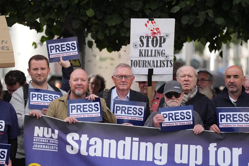 Former RTE journalist and broadcaster Sean O'Rourke (centre) joins members of the National Union of Journalists (NUJ) at the Spire in O'Connell Street, Dublin, in a show of solidarity for Palestinian journalists in Gaza, part of a day of action organised by union members from branches across Ireland and the UK. Photograph: Niall Carson/PA Wire