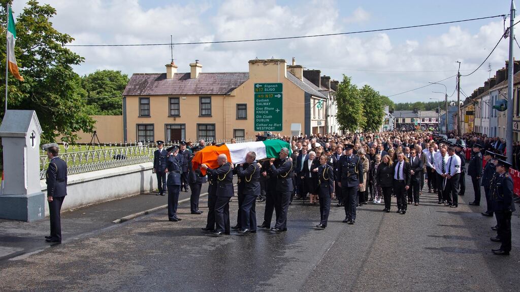 “It seems when God takes the young he takes only the best.” The coffin of  Det  Garda Colm Horkan is carried in Charlestown, Co Mayo. Photograph: Colin Keegan, Collins Dublin