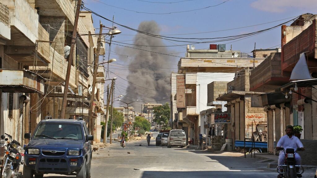 Smoke rises 4 kilometres east of Khan Shaykhun in the southern countryside of Idlib province. Photograph: Anas/AFP/Getty Images