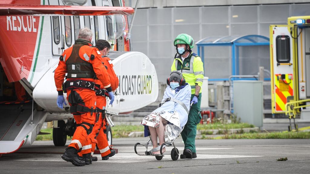 One of the two women rescued in Galway Bay being taken off the Coast Guard helicopter at UCHG. Photograph by Aengus McMahon