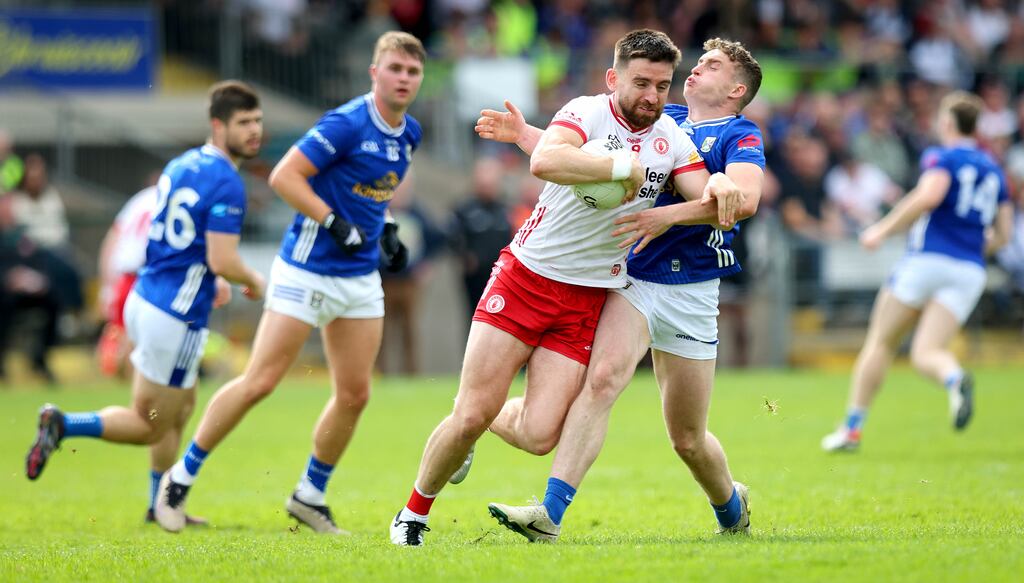 Tyrone’s Padraig Hampsey in action against Cavan's Cormac O'Reilly. Photograph: Ryan Byrne/Inpho