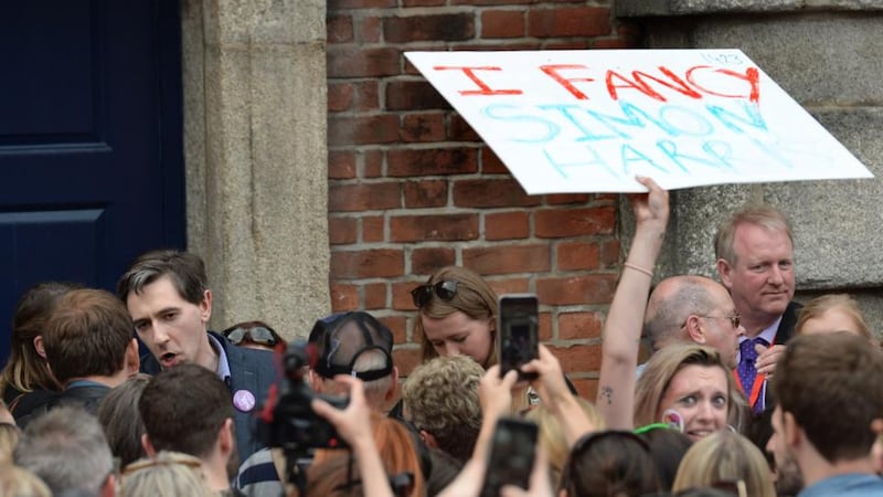 Voter appeal: a Simon Harris fan as the Minister for Health joins the Dublin Castle crowd. Photograph: Dara Mac Dónaill