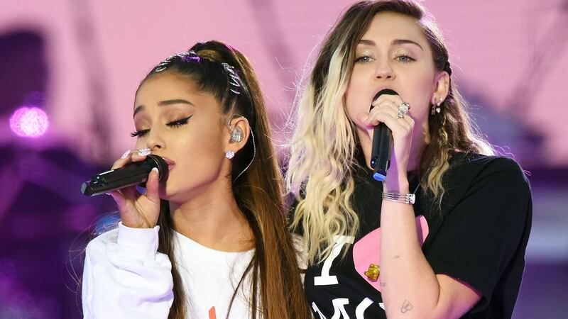 Ariana Grande (left) and Miley Cyrus (right) performing during the One Love Manchester benefit concert for the victims of the Manchester Arena terror attack. Photograph: Dave Hogan for One Love Manchester/PA Wire