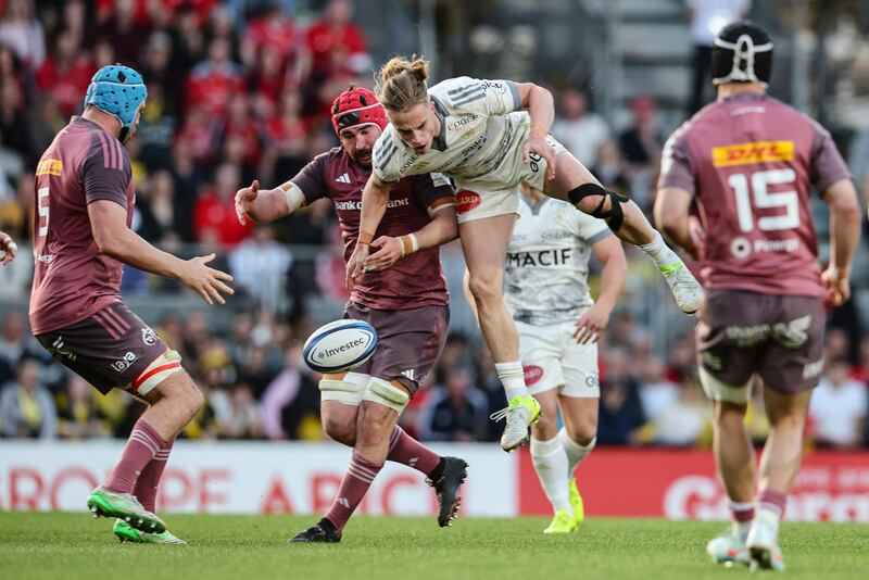 Munster's John Hodnett in action with Stade Rochelais' Hoani Bosmorin at Stade Marcel Deflandre. Photograph: Billy Stickland/Inpho