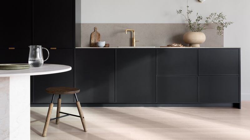 A Fronteriors framed black kitchen.