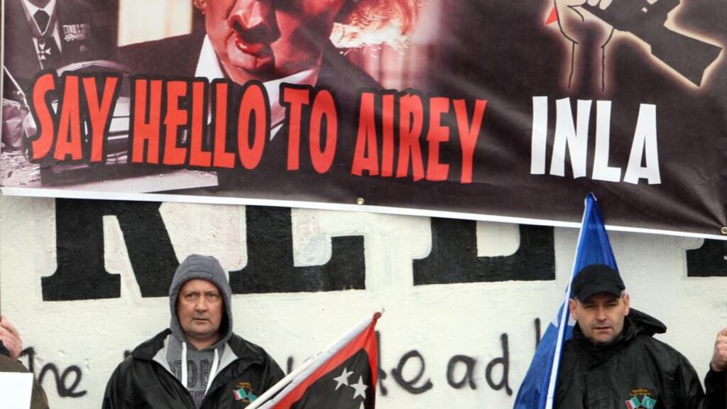 Republicans in the bogside area of Derry, mark the death of Margaret Thatcher, carrying a poster referring to the INLA murder of Tory MP Airey Neave. Photograph: Paul Faith/PA Wire