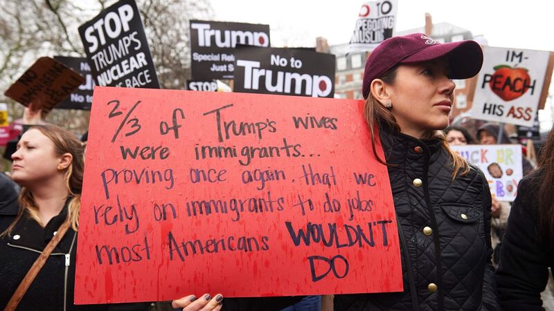 Demonstrators holding placards take part in a protest against US President Donald Trump outside the US Embassy in London. Photograph: Niklas Halle’n/AFP/Getty Images