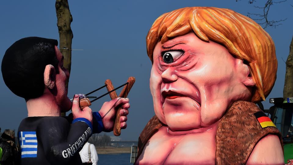 Life in politics: Greek prime minister Alexis Tsipras aims a catapult at Angela Merkel on a carnival float in Düsseldorf in February. Photograph: Patrik Stollarz/AFP/Getty