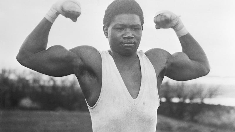 Battling Siki flexes his muscles in the build-up prior to the fight in Dublin in 1923 against Clare-born Mike McTigue.