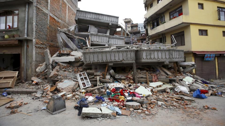 A collapsed building is pictured after an earthquake hit in Kathmandu, Nepal. The shallow earthquake measuring 7.9 magnitude struck west of the ancient Nepali capital of Kathmandu on Saturday, killing more than 449 people. Photograph: Navesh Chitrakar/Reuters.