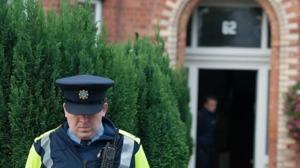A file image showing a garda outside the house on South Circular Road where 25-year-old  Leo Carolan died. Photograph: Dave Meehan/The Irish Times