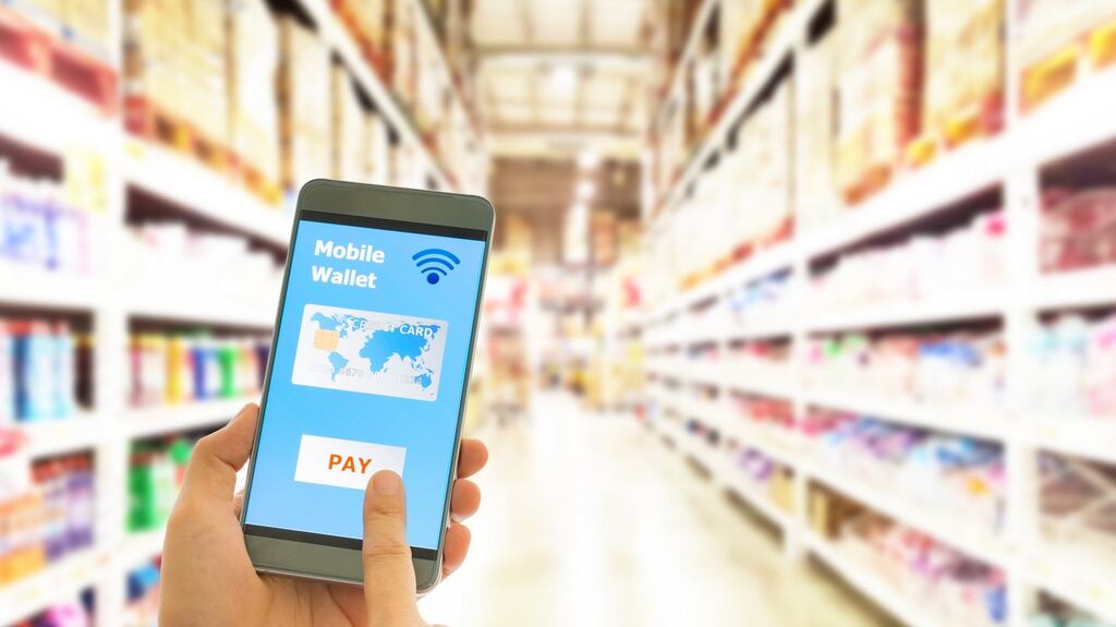 More and more, people are moving away from cash and cards towards electronic payments. Photograph: iStock