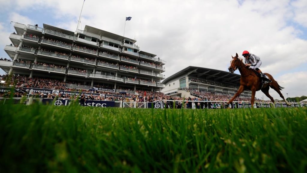 Richard Hughes riding Talent wins the Investec Oaks at Epsom.