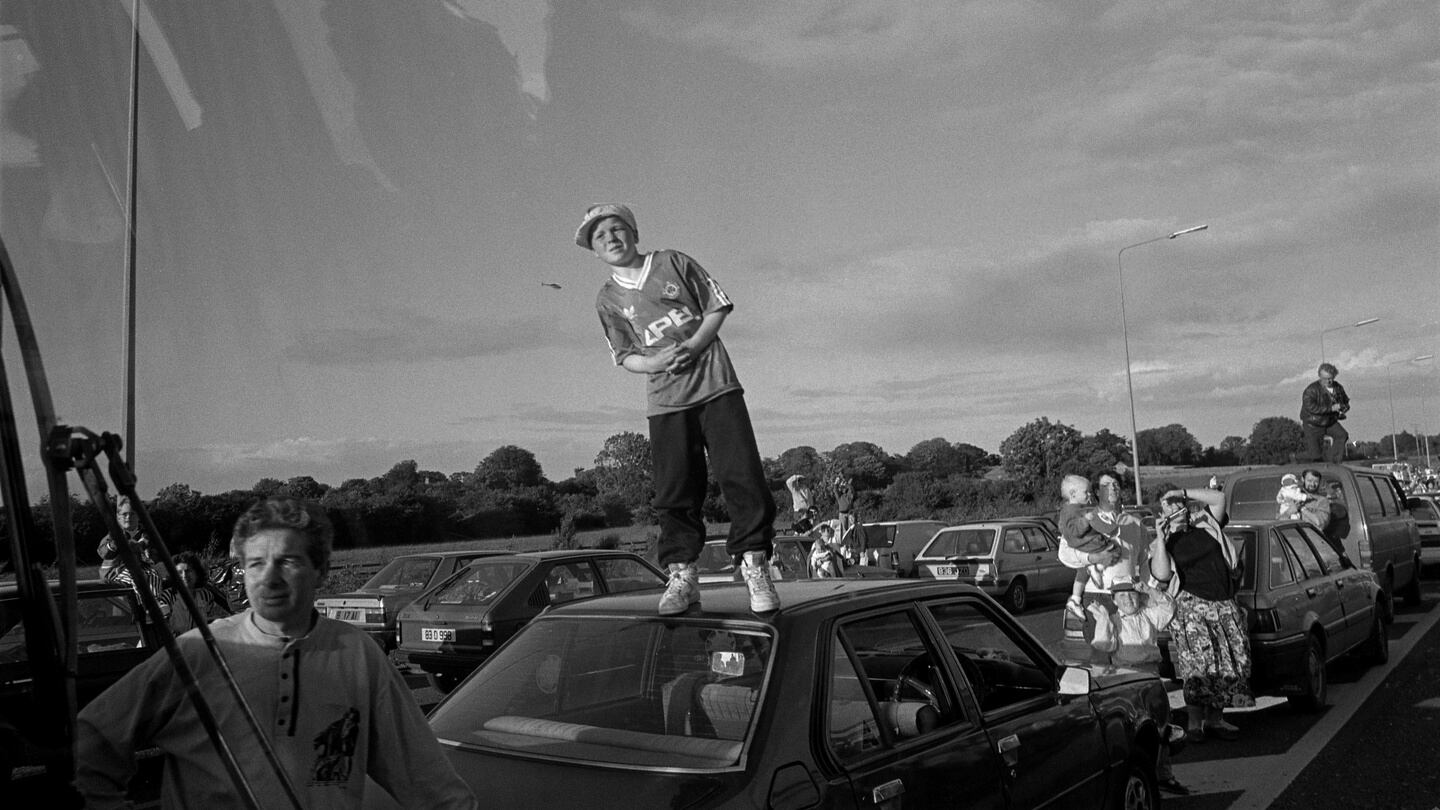 Fans line the route for their returning heroes of Italia ’90. Most of the photographs were taken from a bus which accompanied the returning team as they made their way into the city from Dublin Airport