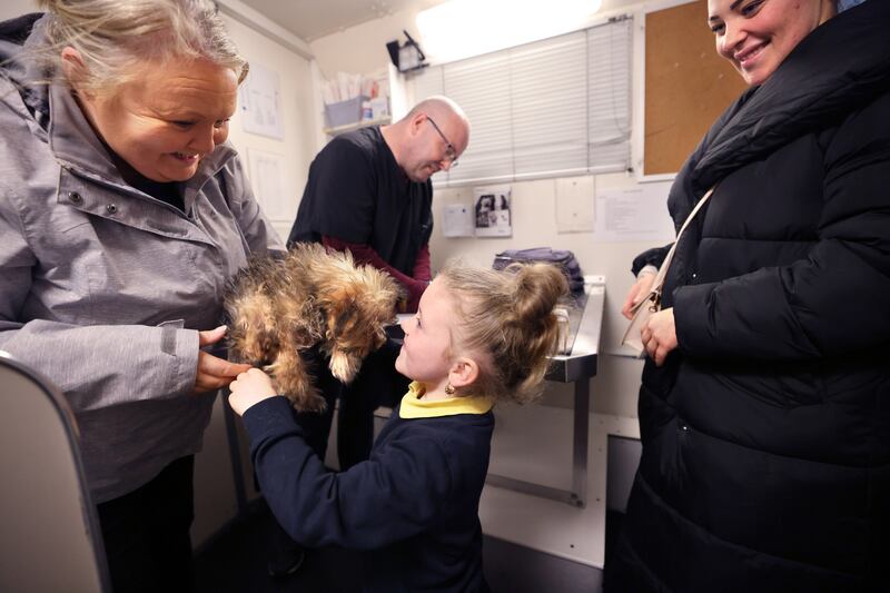 Vet David Horkan and volunteer Pamela Cahill with Megan McKeever her daughter Truly Lou and their dog Cookie. Photograph: Dara Mac Dónaill