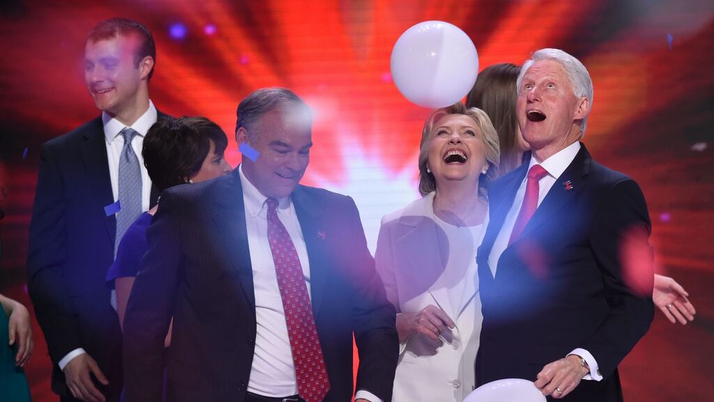 Hillary Clinton celebrates with husband Bill Clinton, running mate Tim Kaine and son-in-law Marc Mezvinsky (left) at the Democratic National Convention in Philadelphia. Photograph: Saul Loeb/AFP/Getty