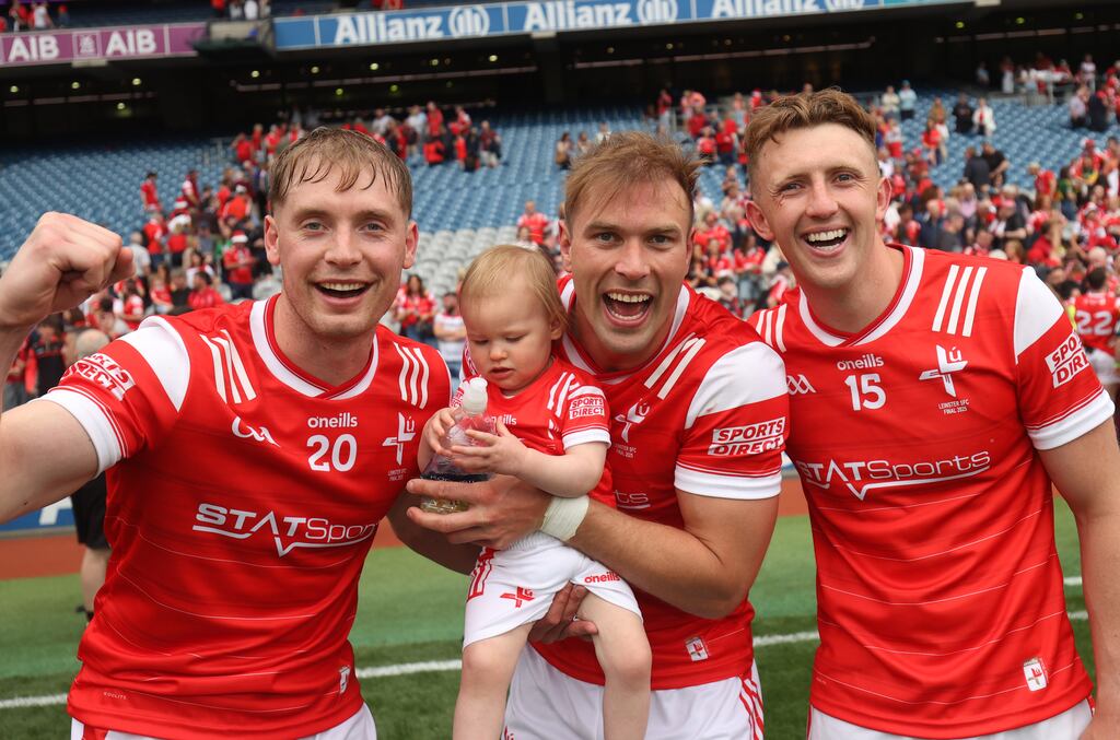 Louth's Ciarán Byrne, Conor Grimes with his daughter Izzy, and Ryan Burns celebrate winning the Leinster SFC title. Photograph: Tom Maher/Inpho