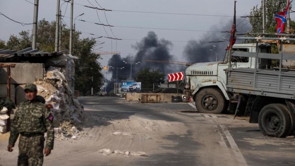 A pro-Russian rebel at a checkpoint following shelling in Donetsk, eastern Ukraine, on Tuesday. Photograph: Reuters/Marko Djurica