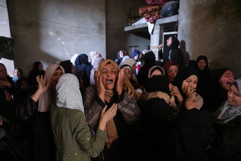 Palestinians mourn members of the Azzam family who were killed in Israeli strikes on their home in central Jabalia in the northern Gaza on Thursday. Photograph: Bashar Taleb/AFP via Getty Images