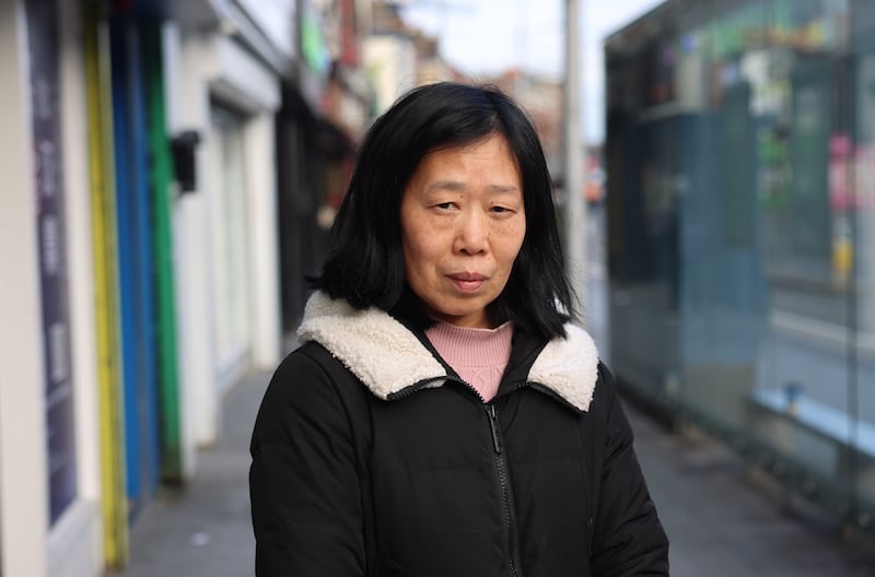 Chinese-born Li Fei Mou on Parnell Street in Dublin. 'Things have changed in 23 years. Irish people are not so nice any more.' Photograph: Dara Mac Dónaill
