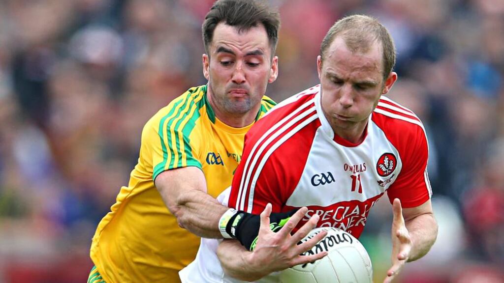 Donegal defender Karl Lacey tackles Derry’s Seán Leo McGoldrick during Sunday’s Ulster quarter-final at Celtic Park, Derry. Photograph: Inpho