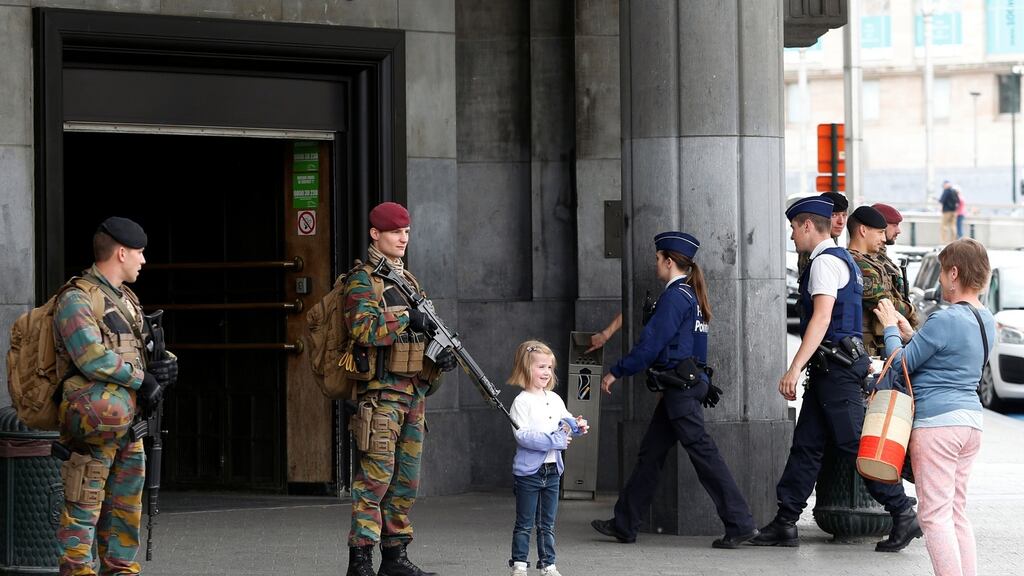 Belgian solders stand outside the central train station in Brussels which was evacuated after a suspect package was found on Sunday. Photograph: Reuters