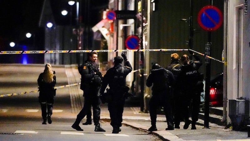 Police stand at the scene after a bow-and-arrow attack in Kongsberg, Norway. Photograph: Hakon Mosvold Larsen/ NTB Scanpix via AP