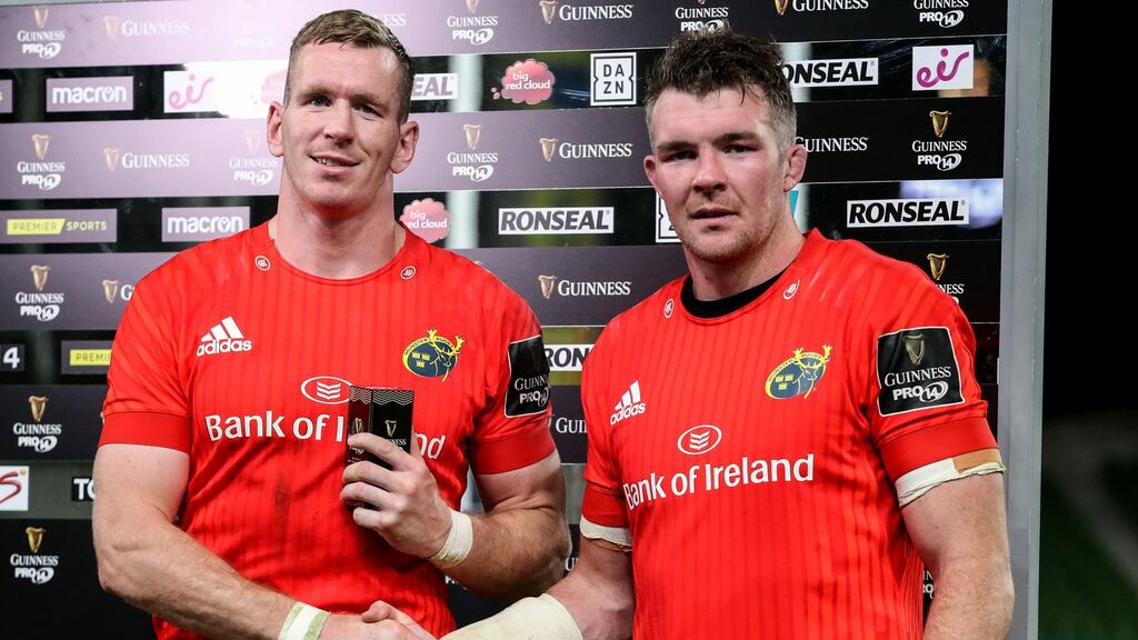 Munster’s Chris Farrell is awarded the Pro14 man of the match award at the Aviva Stadium on Saturday by his captain Peter O’Mahony. Photograph: Inpho